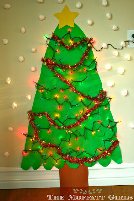 We made our own Christmas tree with real lights and garland! 